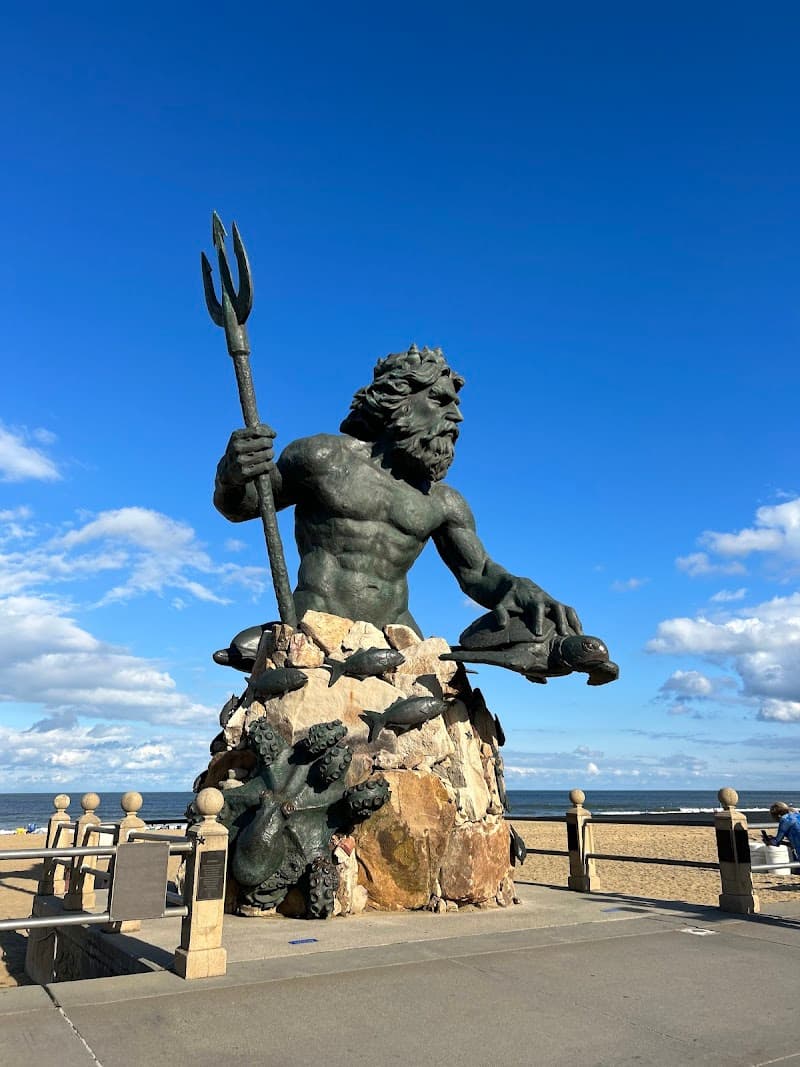 Neptune Statue & Beachfront Sunset